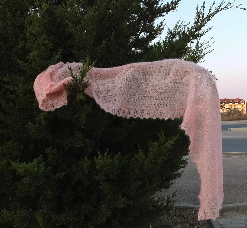 A luxurious knitted scarf by Olha Stefanishyna, featuring an elegant design